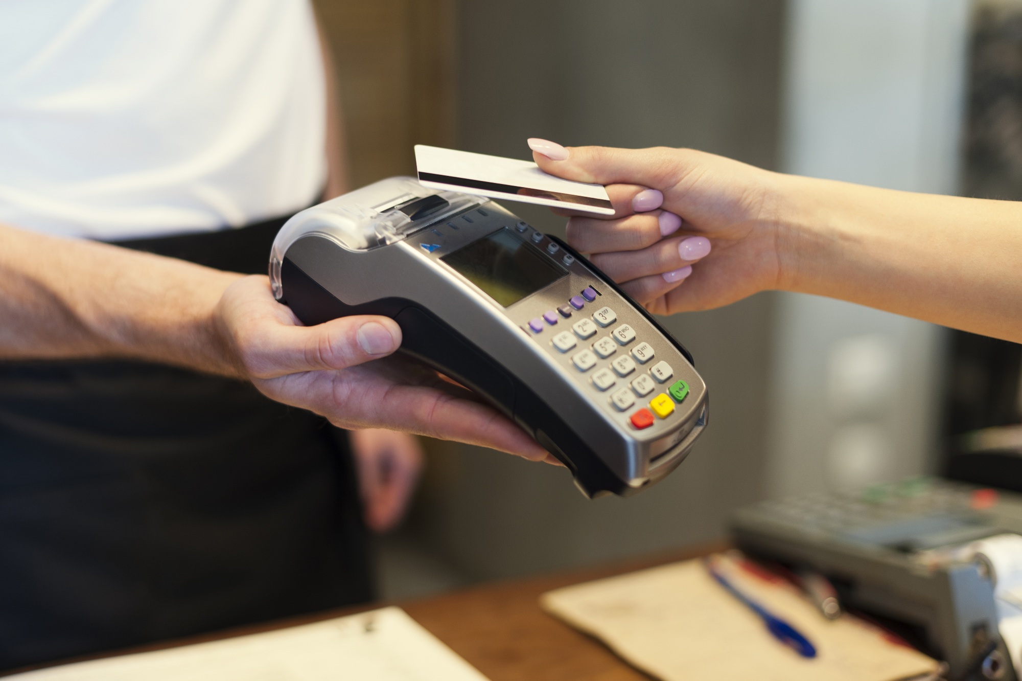 Close up of customer paying by credit card?